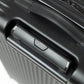 Close-up of a black suitcase handle on a white background