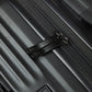 Close-up of a black suitcase zipper with a textured surface