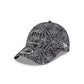 Black and white patterned cap with brand logos on a white background
