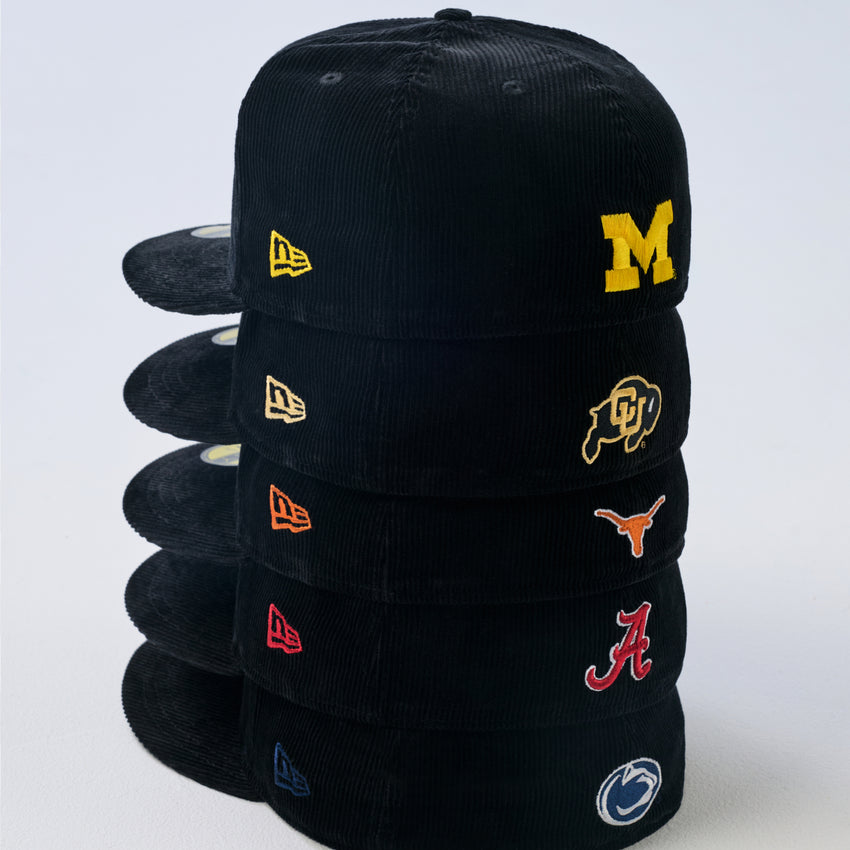 Shop Just Caps College Varsity Script headwear