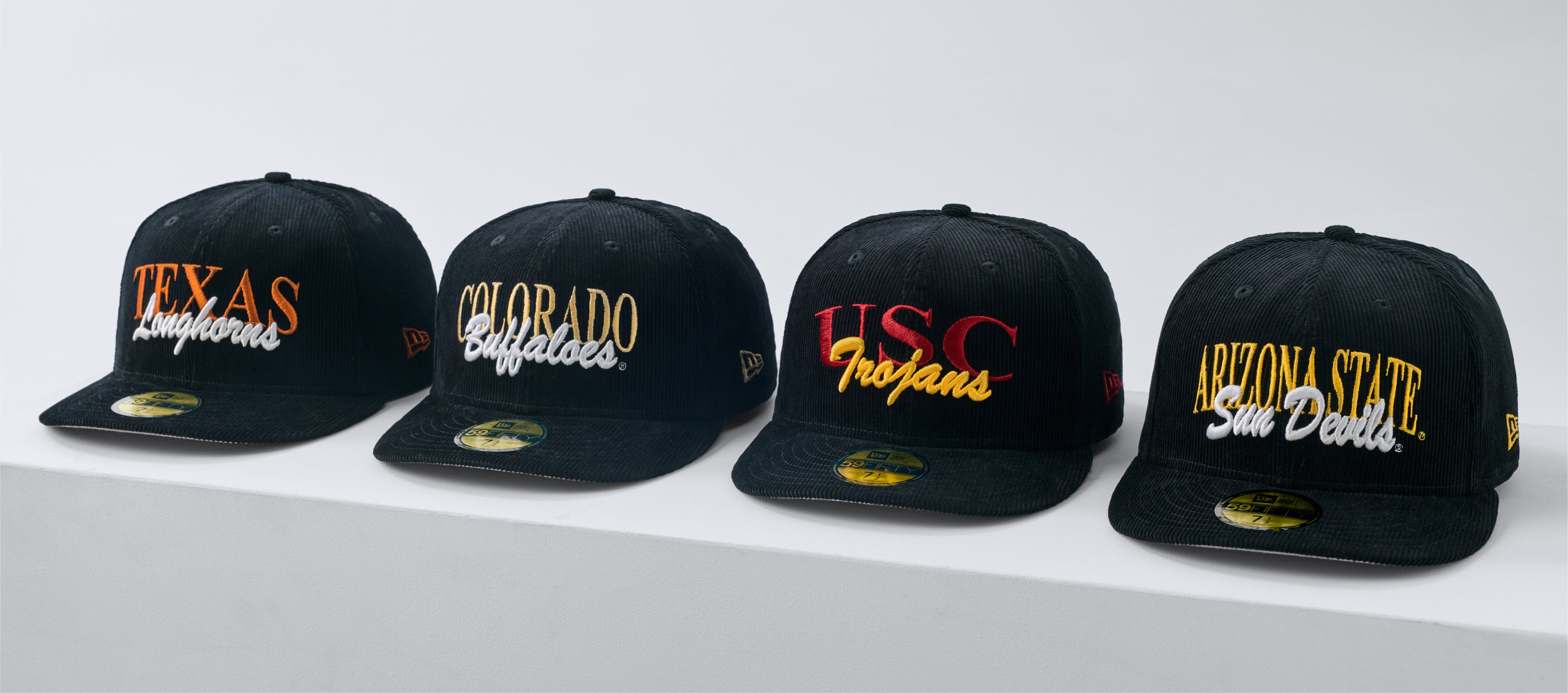 Shop Just Caps College Varsity Script headwear