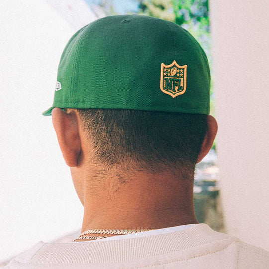 Back of a green NFL Visor Bloom hat