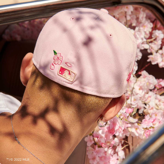Back of a MLB Blossoms hat featuring the MLB Batterman and cherrry blossom design